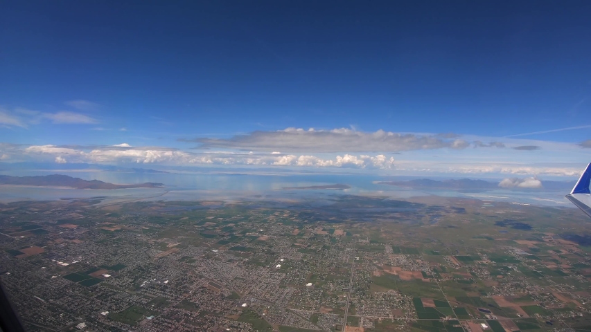 Flight Over Great Salt Lake Utah Michigan Chicago Wyoming Idaho City Canyon Mountain Wasatch Range Spring Vacation Airplane Travel Trip Colors Blue Sky Epic Clouds Cinematic Video USA 4K