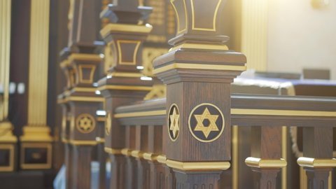 Star of David, Jewish symbol on wood in synagogue in sunlight, close up