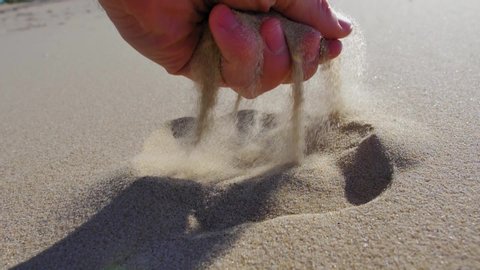 Adult Male Hand Takes Sand from Beach Close Up Slow Motion