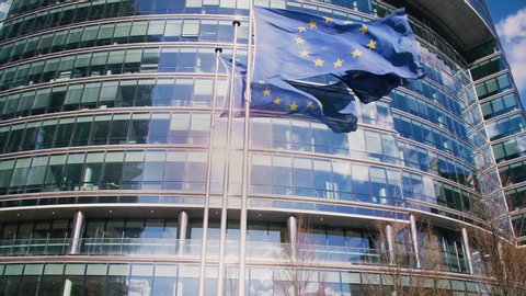European Union building with waving European Flags (4k)