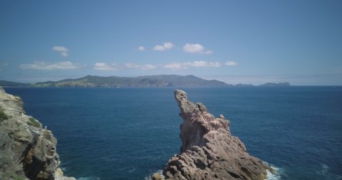 Rocky outcrop at the entrance to Arid Cove in the Hauraki Gulf, New Zealand