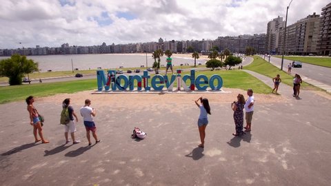 Montevideo, Uruguay - January 15: Aerial view of tourists taking photos at the Montevideo sign in Montevideo, the capital and largest city of Uruguay. 