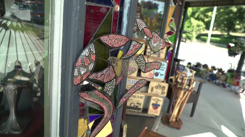 Close up of hanging animal glass sculpture with colored patterns