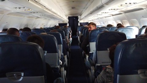 St. Petersburg, Russia - June, 07,2019. Economy class interior, aircraft cabin. Passengers sit in their seats.