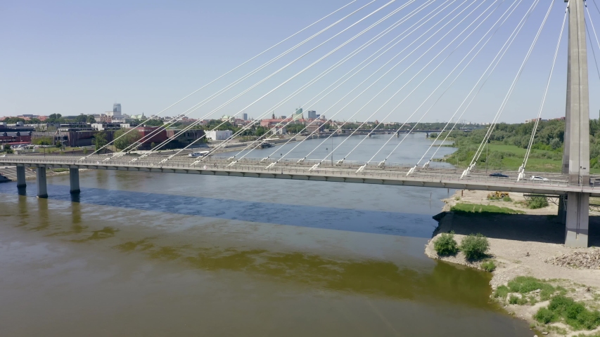 4K. Aerial view of Swietokrzyskie  Bridge in Warsaw, Poland. Panorama from the bridge to the skyscrapers of Financial District. Warsaw. Drone Shot 4K.