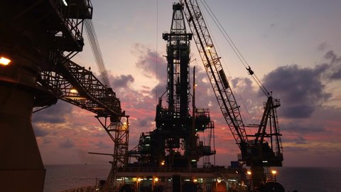 Tender Drilling Oil Rig (Barge Oil Rig) on The Production Platform at Twilight Time
