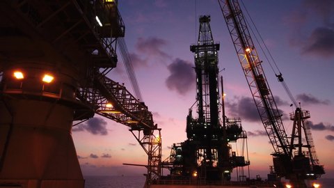 Tender Drilling Oil Rig (Barge Oil Rig) on The Production Platform at Twilight Time
