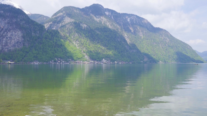 Beautiful little town of Halstatt - latest attraction for tourists from all over the world. View from the other side of the Halstatt See (lake). 