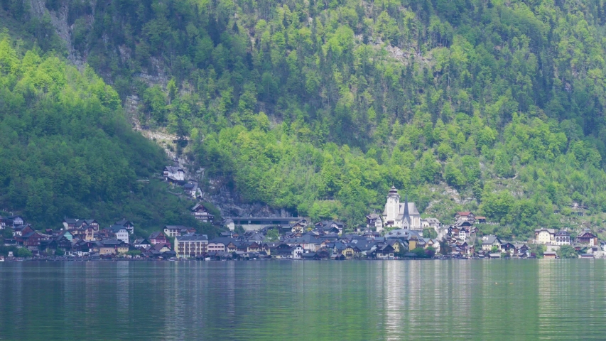 Beautiful little town of Halstatt - latest attraction for tourists from all over the world. View from the other side of the Halstatt See (lake). 