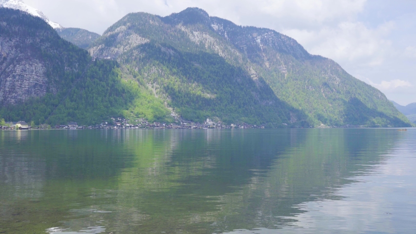 Beautiful little town of Halstatt - latest attraction for tourists from all over the world. View from the other side of the Halstatt See (lake). 