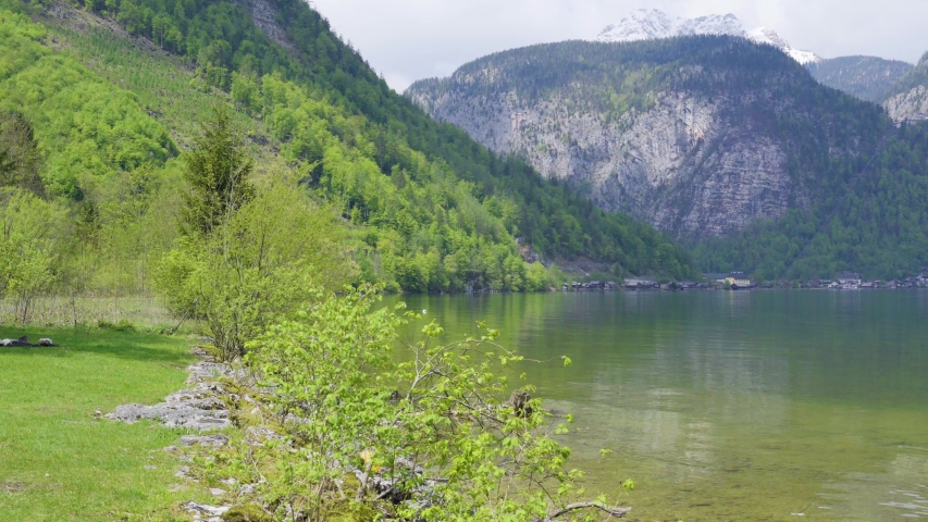 Beautiful little town of Halstatt - latest attraction for tourists from all over the world. View from the other side of the Halstatt See (lake). 