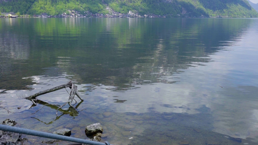 Beautiful little town of Halstatt - latest attraction for tourists from all over the world. View from the other side of the Halstatt See (lake). 