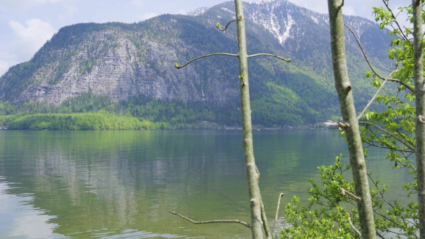 Beautiful little town of Halstatt - latest attraction for tourists from all over the world. View from the other side of the Halstatt See (lake). 