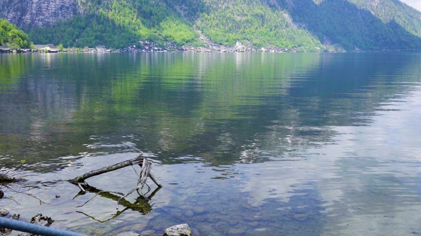 Beautiful little town of Halstatt - latest attraction for tourists from all over the world. View from the other side of the Halstatt See (lake). 