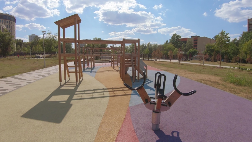 In the city Academichesky Park, a bicycle and a running track among beautiful spruces