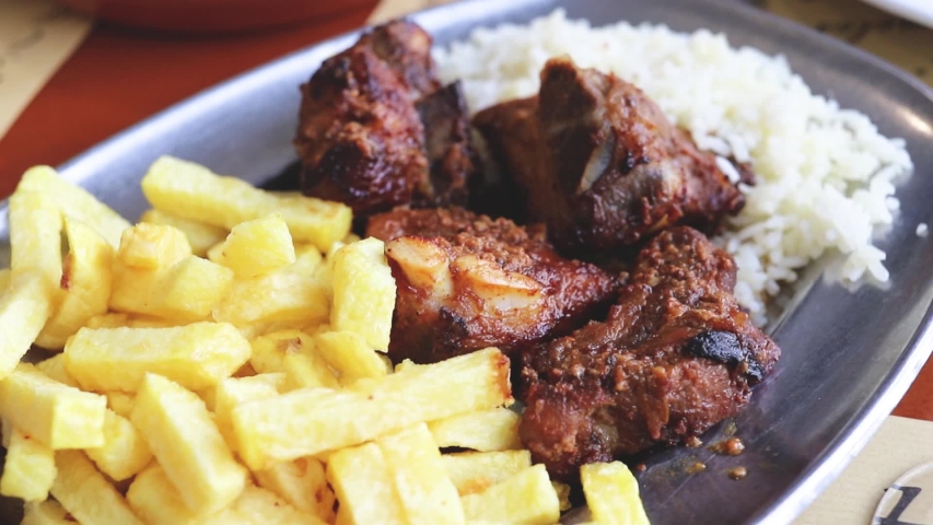 meat with boiled rice and fried potato