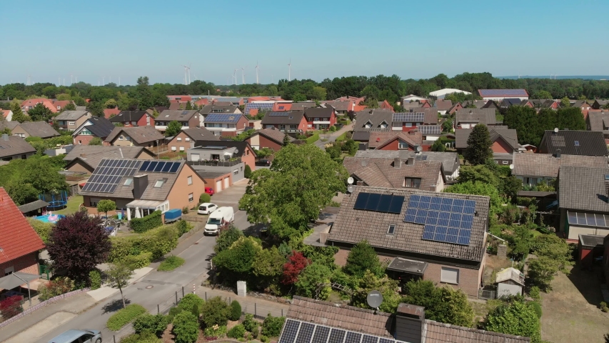 The span of the camera over the roofs of a small German city. Flying camera over the roofs with solar panels. Greven, Germany. Aerial view 4K Royalty-Free Stock Footage #1032424454