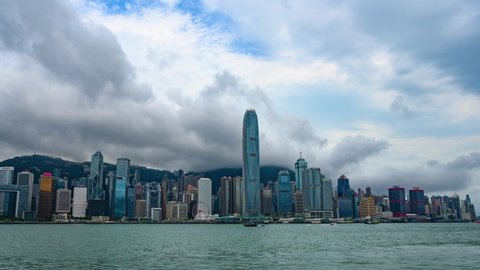 HONG KONG - JUNE 29 2019 : time-lapse of Hong Kong cityscape, skyscraper building at Hong Kong bay