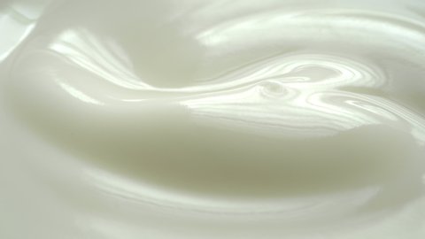 Closeup shot of texture yogurt with rotate.
