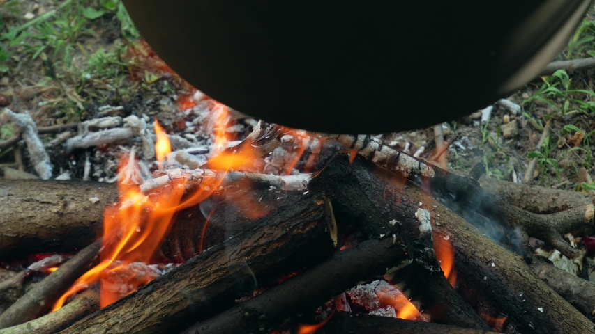 Wood charcoalfire outside camp fire Burning under goulash pan 4k closeup Video

