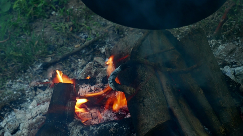 Wood charcoalfire outside, camp fire Burning under goulash pan 4k closeup Video
