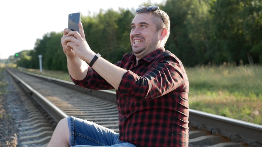 A young man takes a selfie and takes pictures of nature!