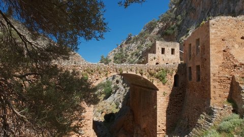 Riuns of abandoned Katholiko monastery church in Avlaki gorge, Akrotiri peninsula, Chania region on Crete island, Greece. Horizontal camera pan