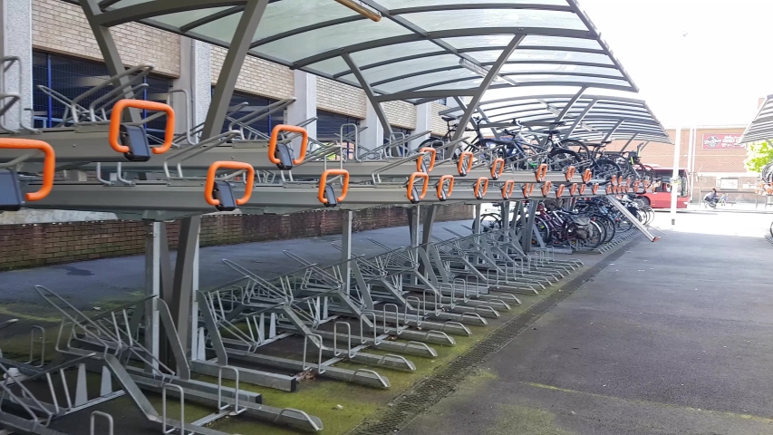 Passing a large bicycle rack in an English town, 4K