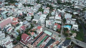 Ho Chi Minh City, Saigon, Vietnam and its architecture, narrow streets and heavy traffic, drone footage taken at dusk