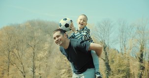 Father and son Soccer players. slow motion video.