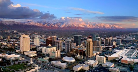 Salt Lake City Utah Skyline at Sunset, Mountains Behind, Aerial Drone