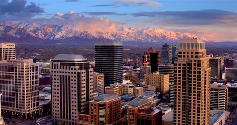 Salt Lake City Utah Skyline at Sunset with Mountains, Aerial Drone