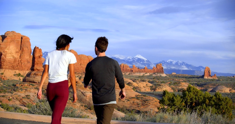 Couple Walking Through Desert, Canyons & Mountains of Utah