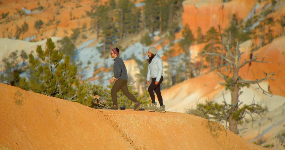 Couple Hiking the Top of Arches National Park, Utah