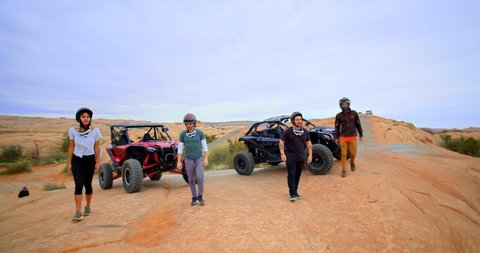 Moab, Utah / USA - April 12, 2019: Group Getting Out of Dune Buggies, Off Roading, Slow Motion