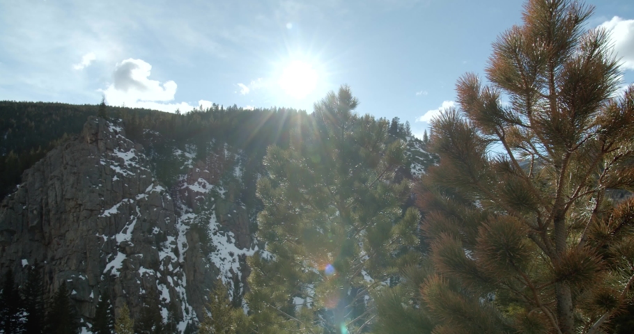 Sun Peaking Over Mountains, Rocky Mountains Colorado, Aerial Drone | Shutterstock HD Video #1032500069