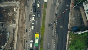 Traffic jam top view aerial footage at ring road Yogyakarta city, Indonesia. Shows of construction progress on site