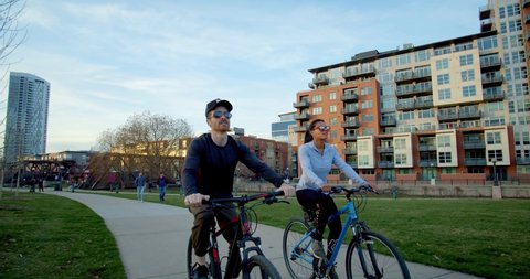 Couple Biking Through Denver Park, Colorado