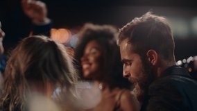 new years eve friends celebrating rooftop party dancing throwing confetti enjoying glamorous celebration wearing stylish fashion social gathering at night 4k - Powered by Shutterstock - Get 15% off with code: PIKWIZARD15