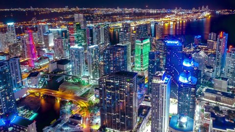 Top down aerial view of busy streets in downtown Miami, Miami City with bright night lighting. Best Miami Aerial shot. Wide shot on 4K camera. Miami downtown hyperlapse.