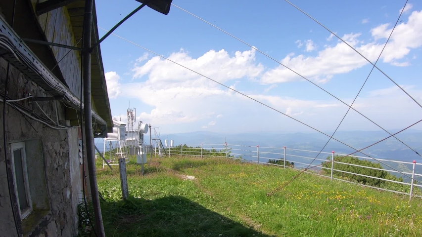 weather station on top of the mountain. clouds moving fast, Romania