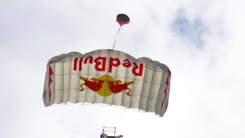 KAZAN, RUSSIAN FEDERATION, JUNE 15, 2019: Wingsuite skydivers descent on parachute, Red Bull Air Race World Championship 2019