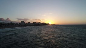 Sun is setting over Ocean Beach in Puerto Rico
