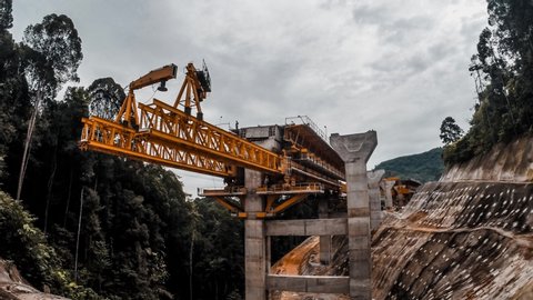 Timelapse footage of bridge launcher system. Also known as Movable Scaffolding System (MSS). This is the under slung launcher method to construct span-by-span in-situ bridges or elevated highways.