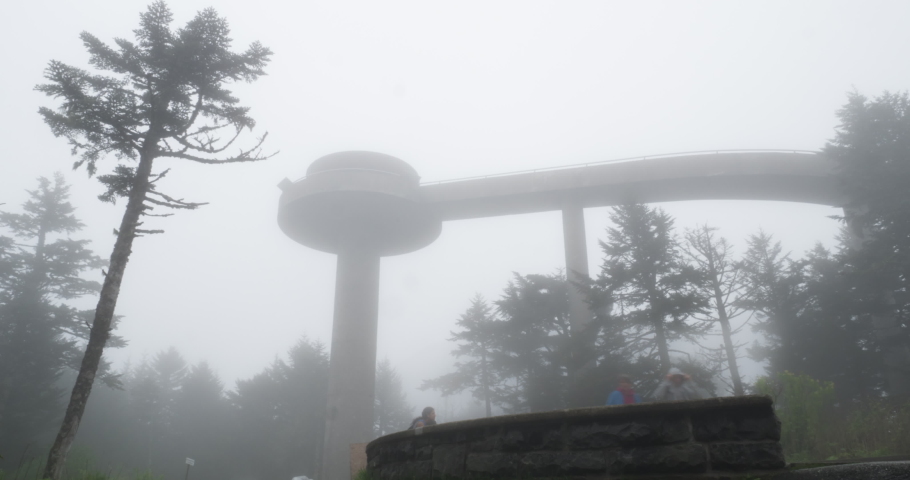 People hiking in fog on Clingmans Dome