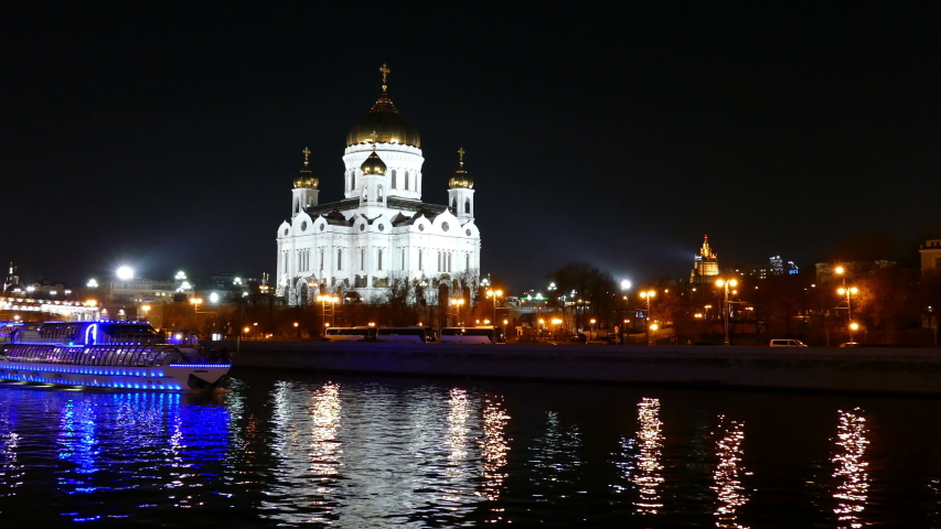 Moscow. The Cathedral of Christ the Savior. Night life of the metropolis does not freeze at night. Tourists walk, cars rush, the city is full of bright lights.