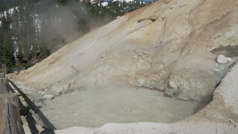 Boiling muddpot with sulfuric smelling steam rising above at Lassen Volcanic National Park.