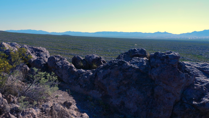 Mountain View Panning Right in Desert. view moves right on a desert scene with mountains