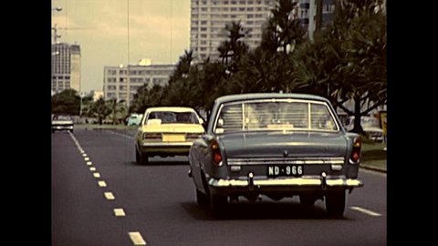 DURBAN, South Africa - circa 1981: street view with vintage cars and vintage bus on the Durban downtown traffic. Historical archival footage in Durban city of 1980s in South Africa.