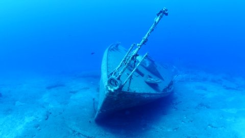 ship wreck underwater scuba divers to search and explore ocean bottom scenery of metal underwater